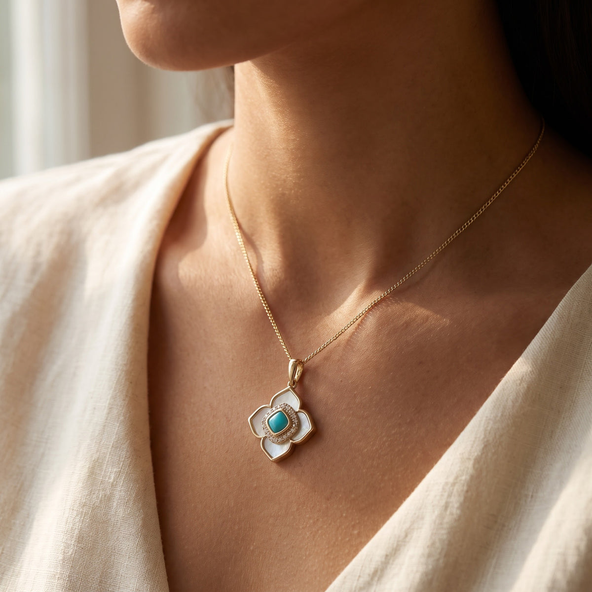 Yellow Gold Turquoise and Mother-of-Pearl Quatrefoil Charm Necklace, worn