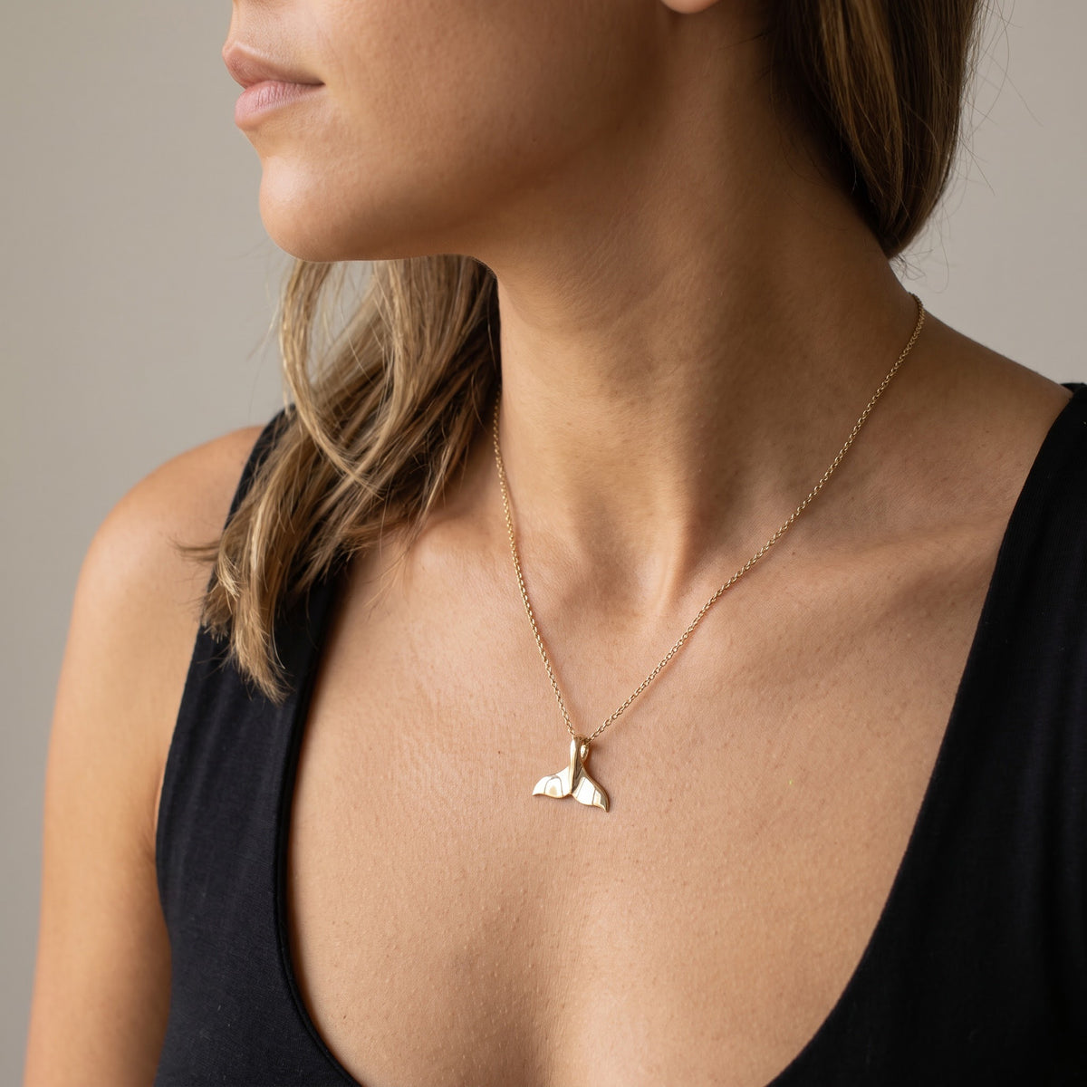 Yellow Gold Whale Tail Charm Necklace, worn, second view