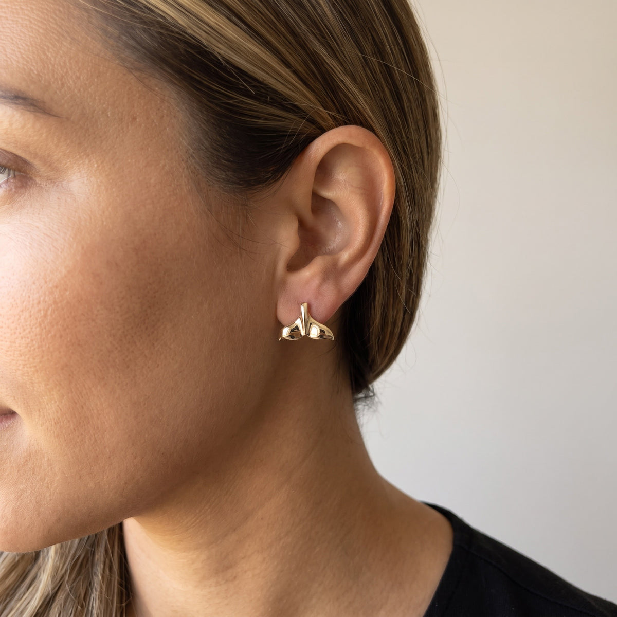 Yellow Gold Whale Tail Stud Earrings, worn, second view