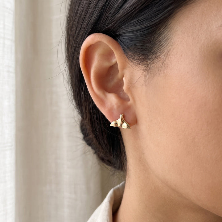 Whale Tail Stud Earrings in 14K Yellow Gold, worn